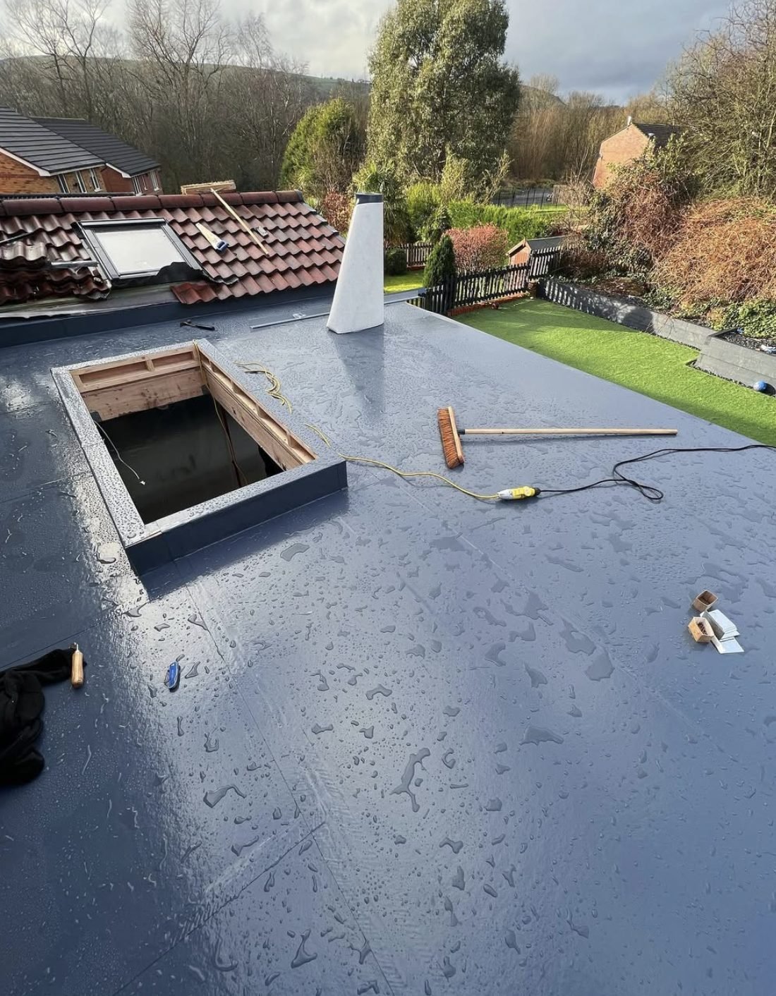 Newly finished flat roof with a rooflight upstand