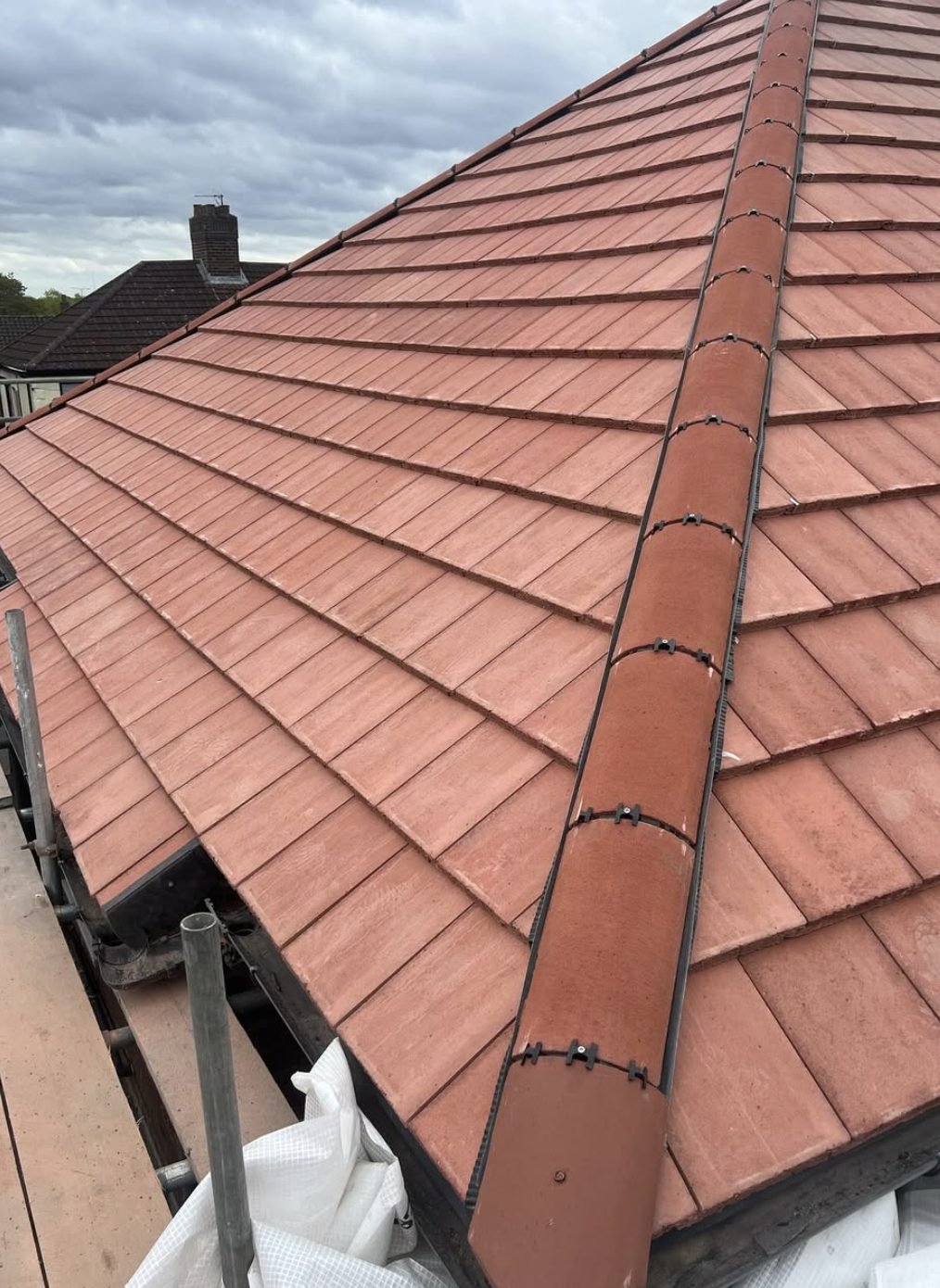 Red tiled roof with a dry-fixed hip line