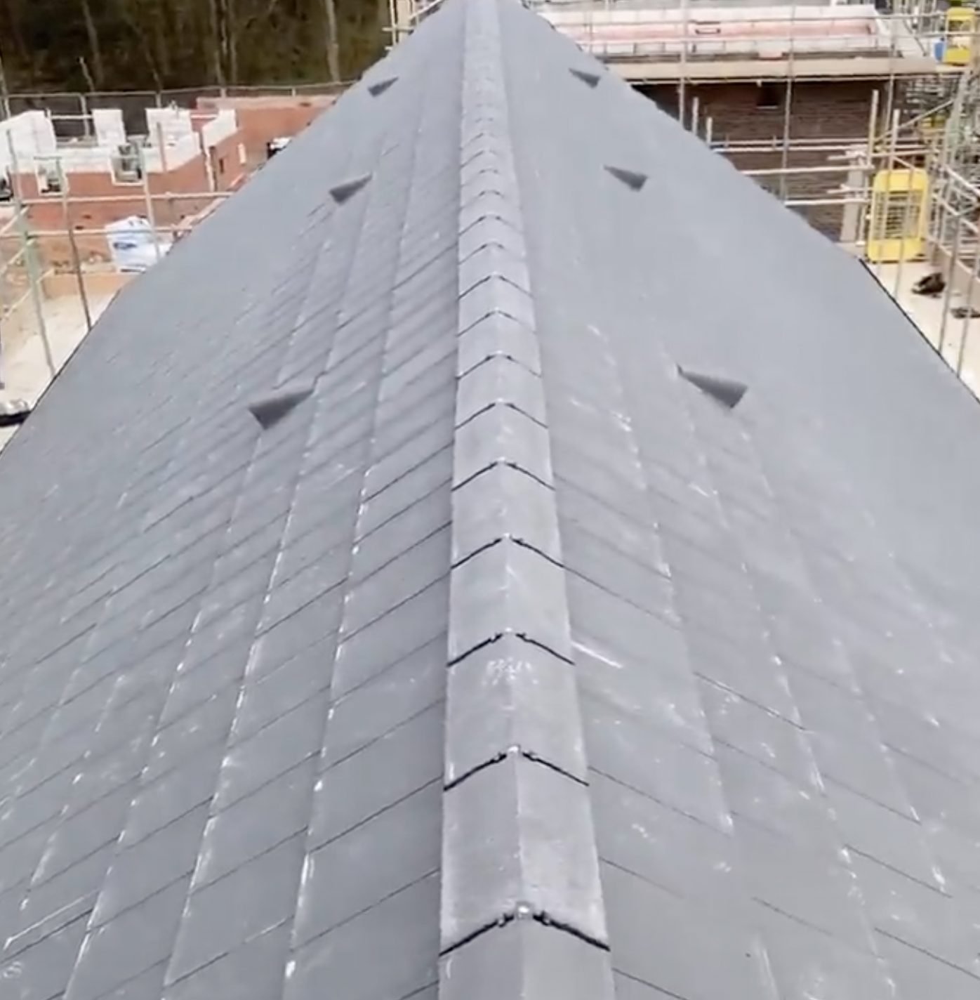Ridge line along a freshly slated new-build roof